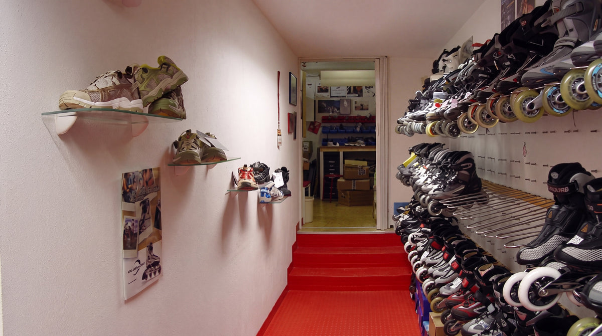 Passage to the inline workshop with recreational skates and Nordic walking shoes